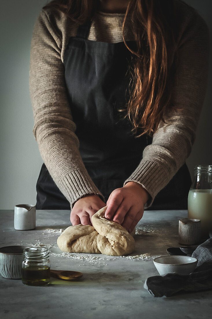 Girl kneading dough