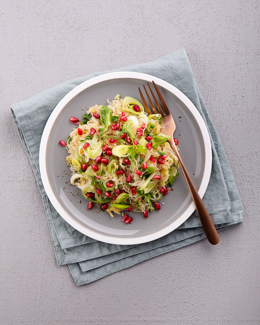 Sauerkraut salad with leek, honey and pomegranate seeds