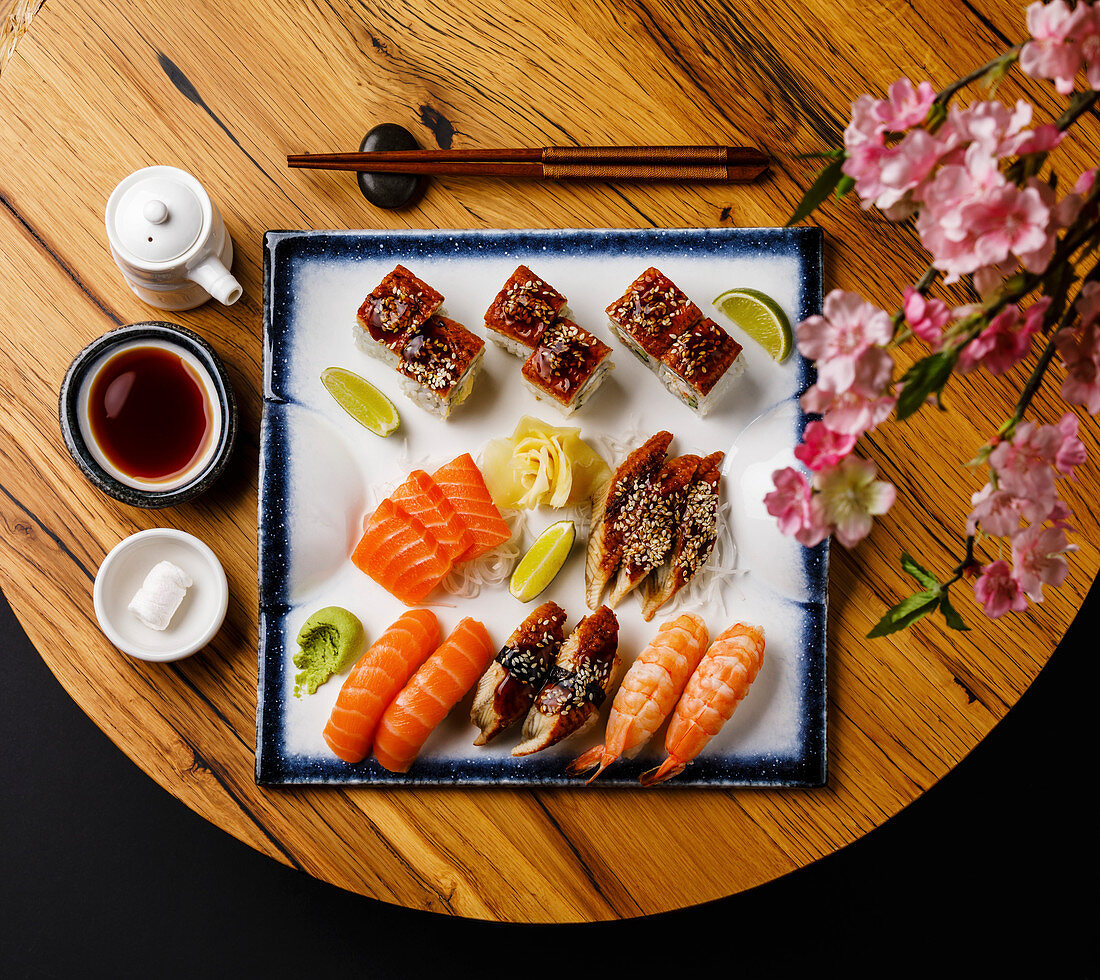 Sashimi and Nigiri sushi set on wooden table