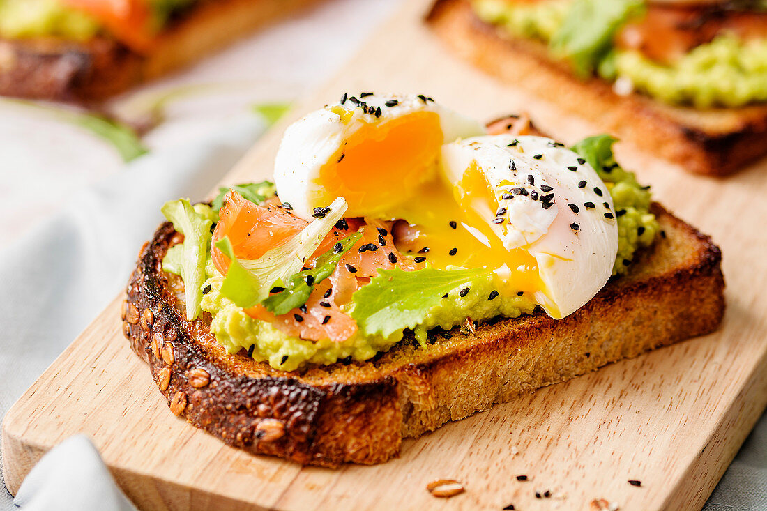 Smoked salmon toast with avocado cream and poached egg