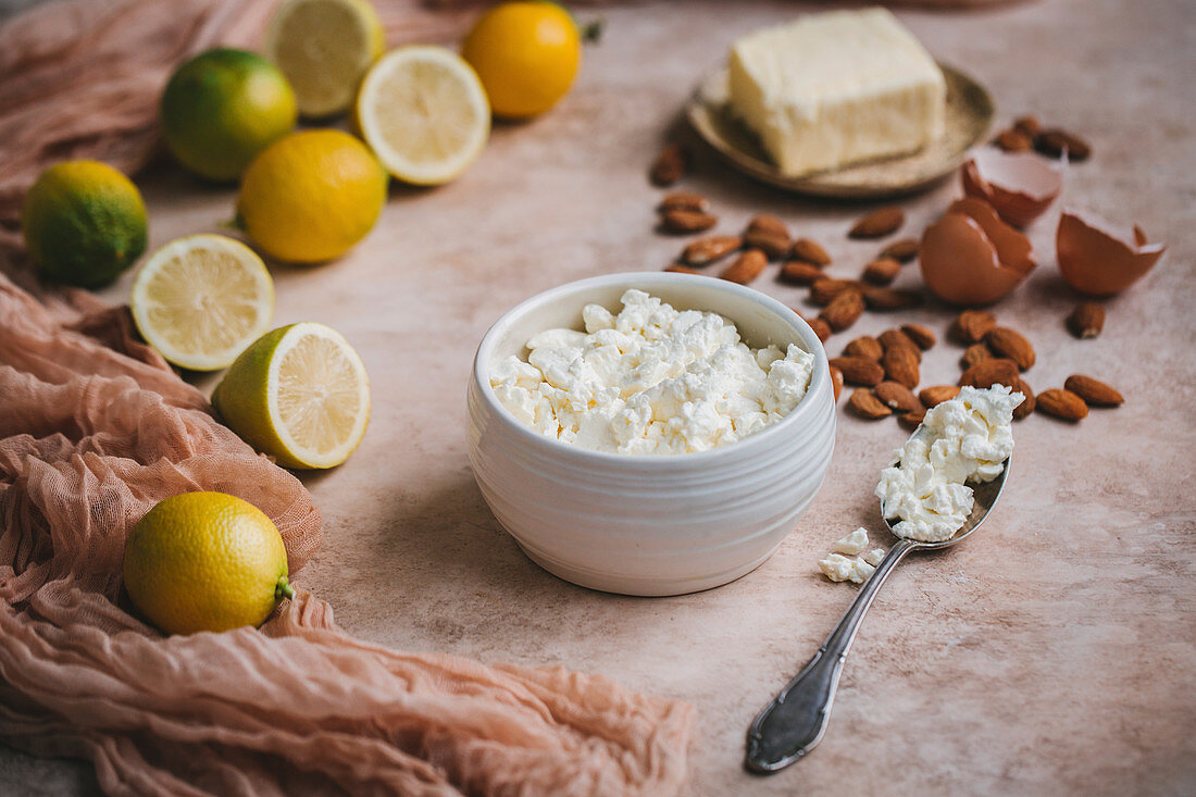 Baking ingredients: cottage cheese, lemons, almonds, ricotta