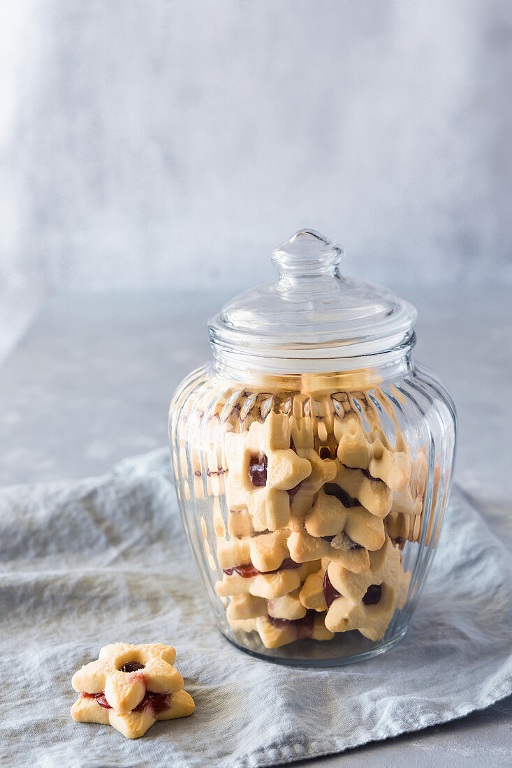 Strawberry vanilla sandwich cookies in a jar