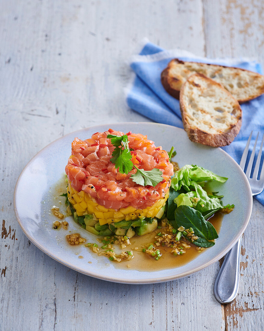 Salmon tartar with avocado and mango