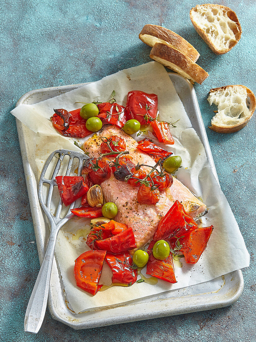 Salmon with baked red bell pepper, tomato and olives