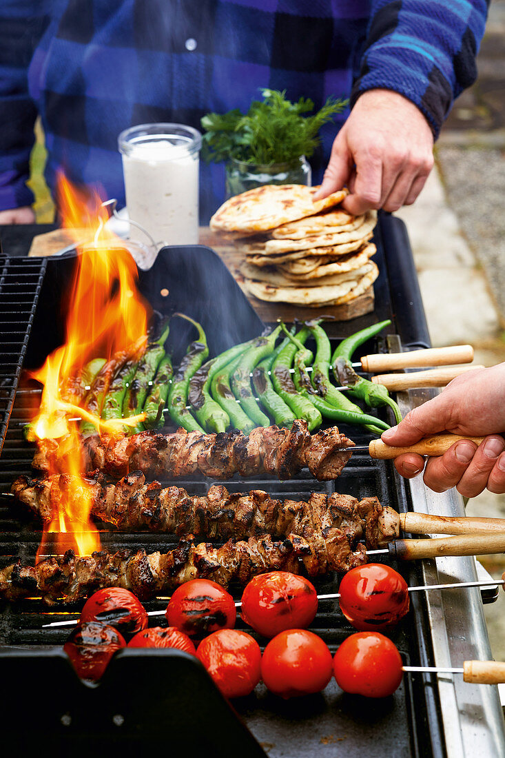 Grilled lamb kebabs with tomato and pepper skewers