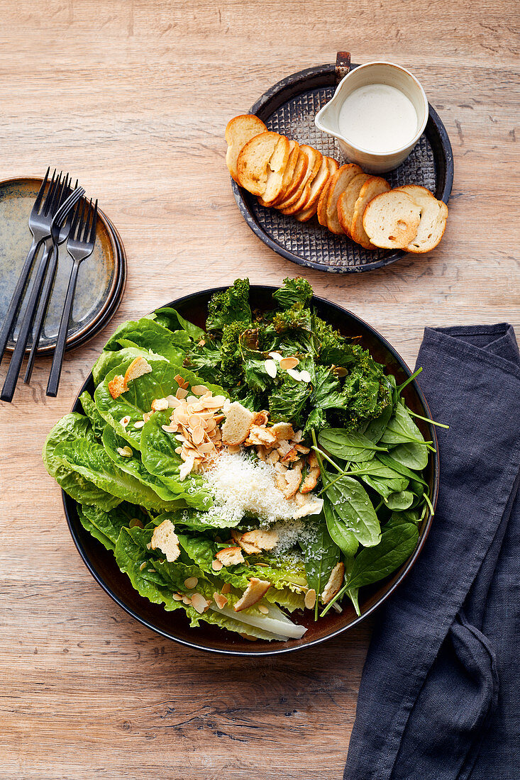 Caesar salad with crispy kale and flaked almonds