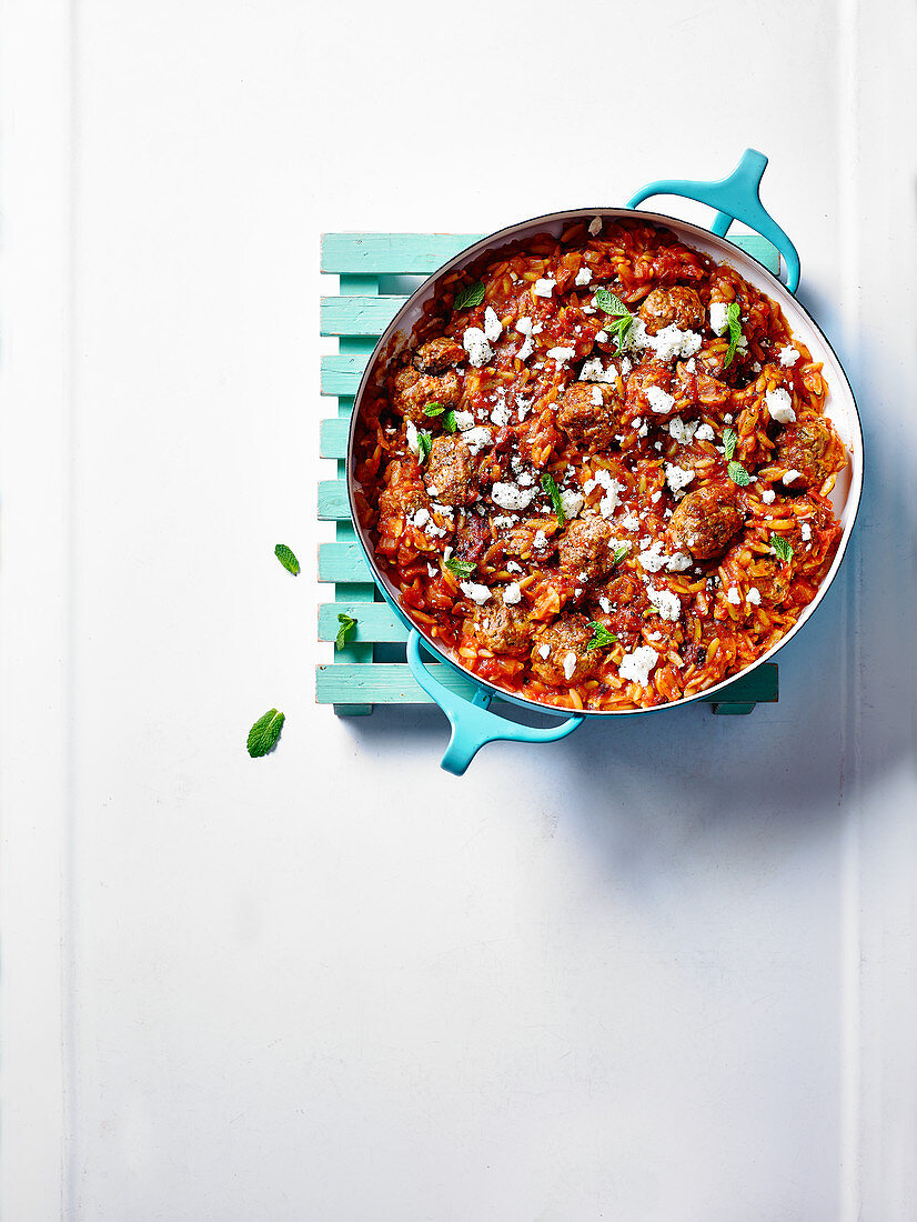 Meatballs and orzo in tomato sauce