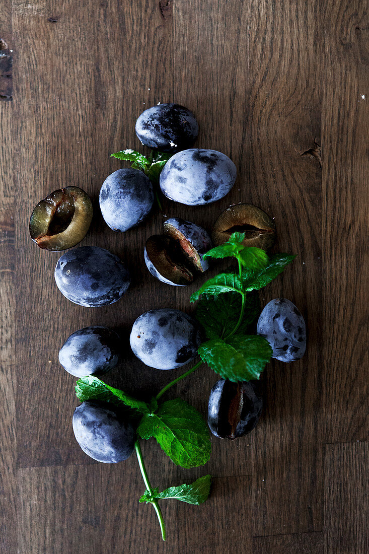 Plums on a wooden background