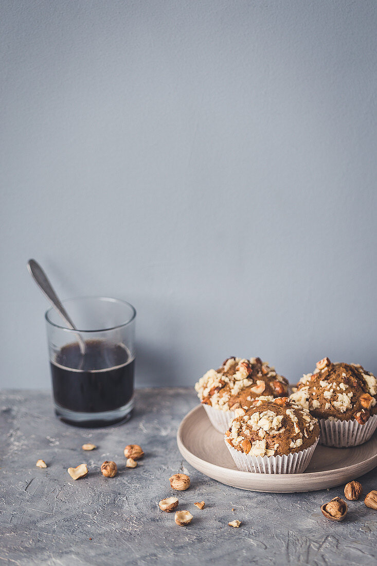 Coffee and hazelnut muffins and a glass of coffee