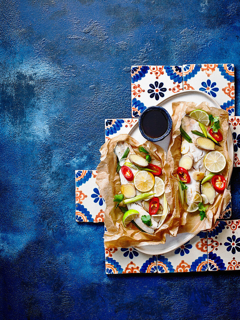 Baked sea bass with vegetables, ginger and soy sauce