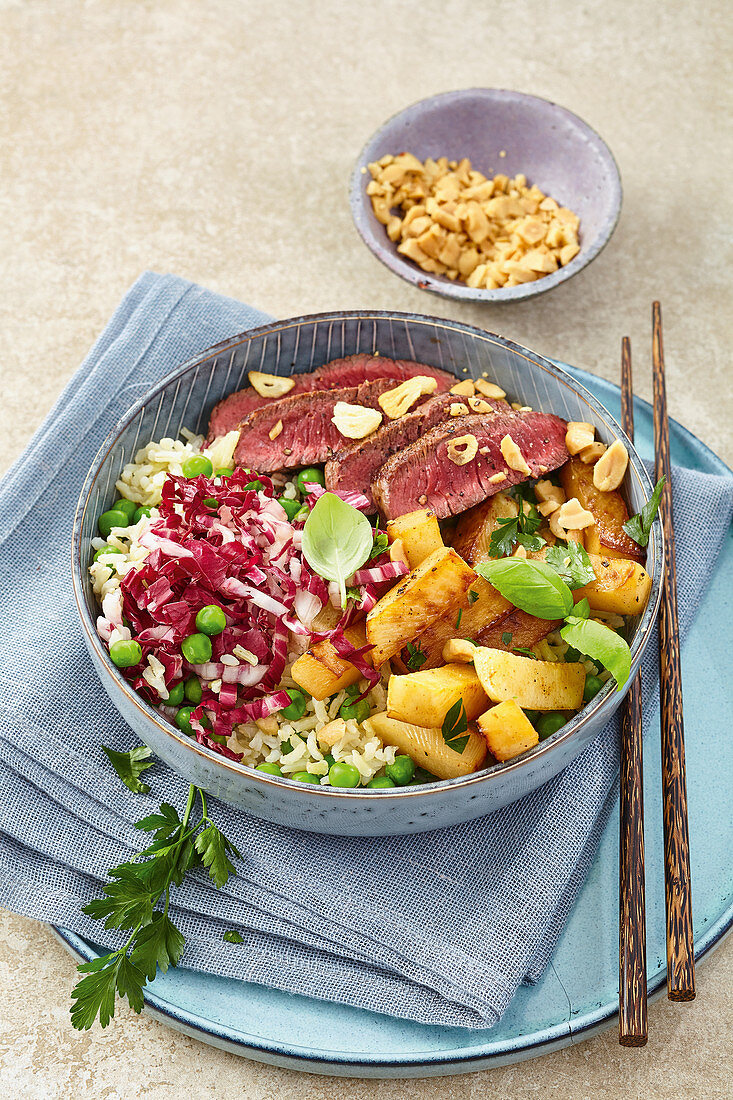 Rice bowl with sweet and sour radish and steak strips