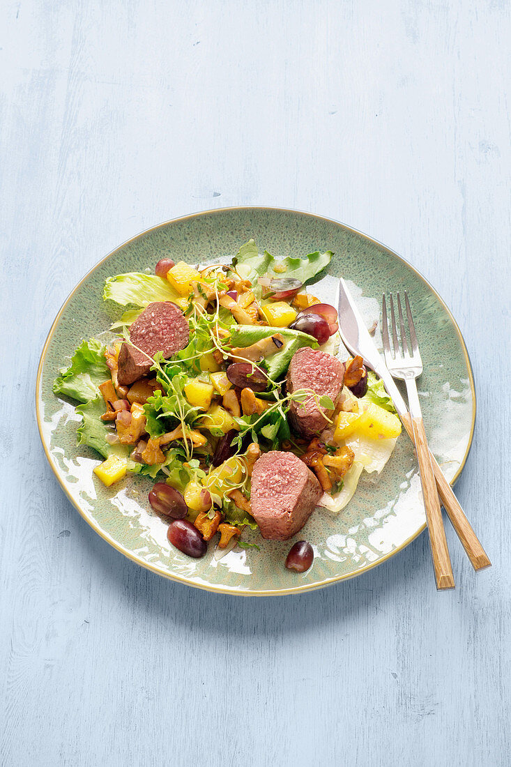 Endive salad with venison, potatoes, chanterelles and mustard vinaigrette