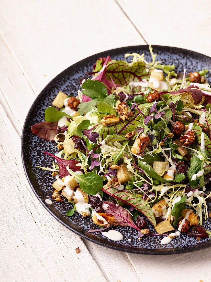 Sweet salad with parsnips, cranberries and hazelnuts