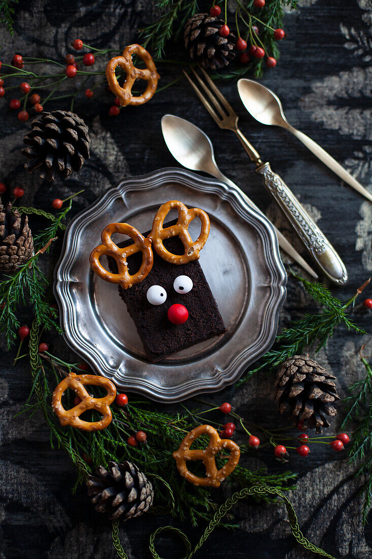 Slices of chocolate cake decorated with pretzels