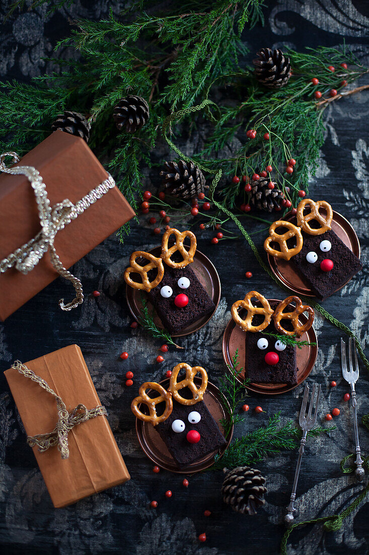 Slices of chocolate cake decorated with pretzels