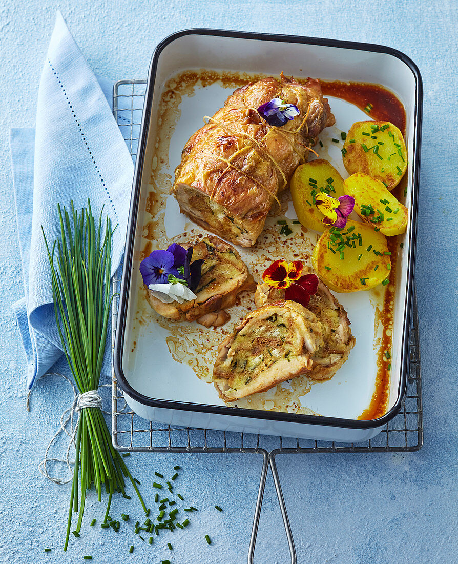 Chicken roll with herb filling and violets