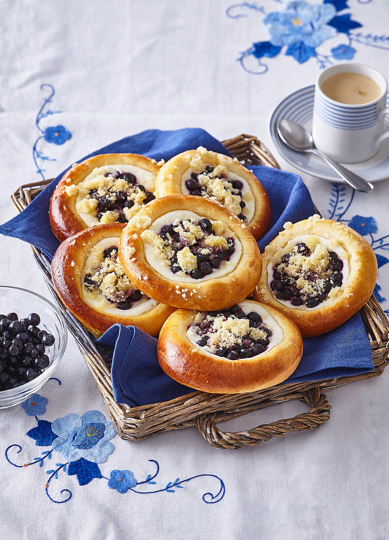 Yeast pastries with custard and blueberries