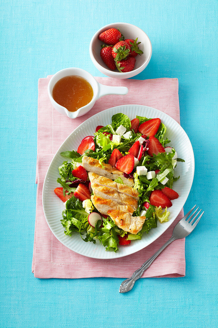 Salad with grilled chicken, strawberries and feta cheese