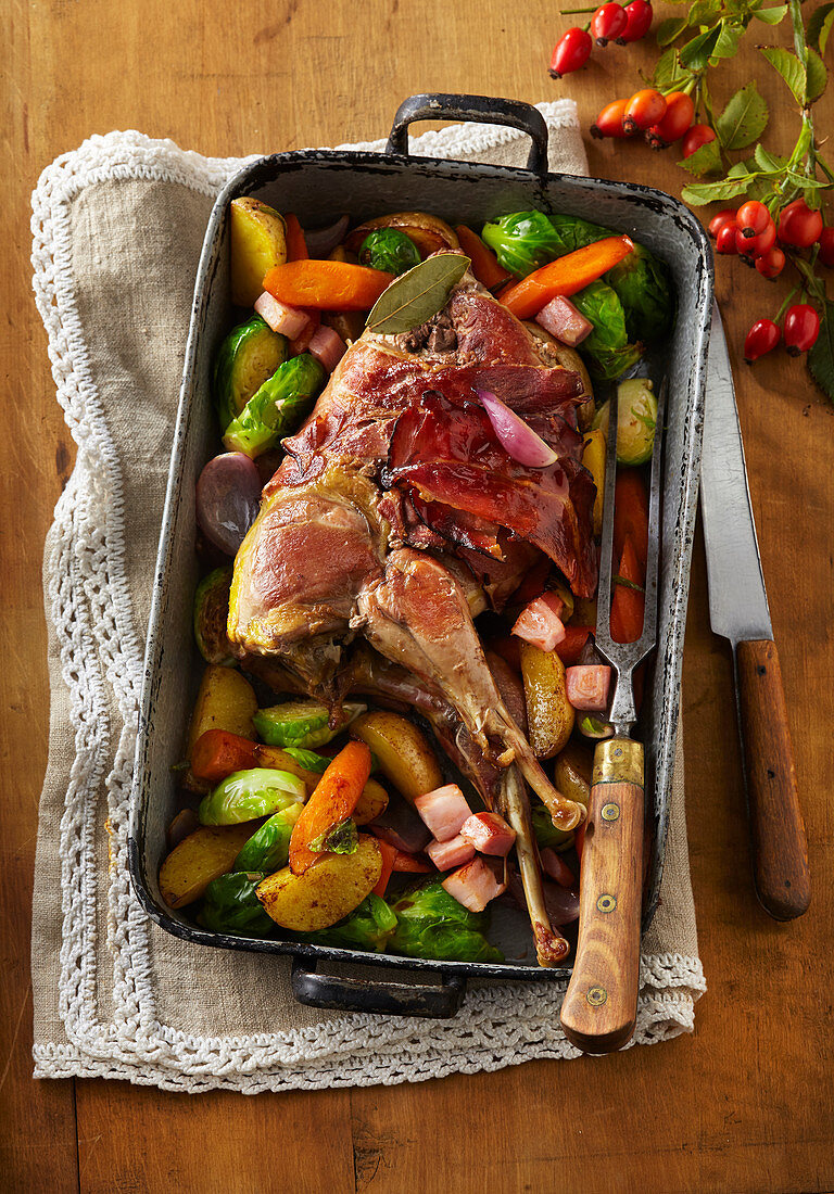 Pheasant with striped bacon and vegetables