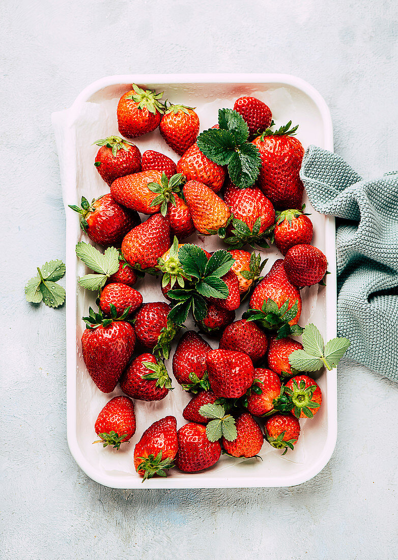 Fresh strawberries on a metal tray
