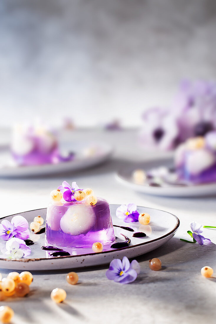 Lavender jelly with lychee, violets and white currants