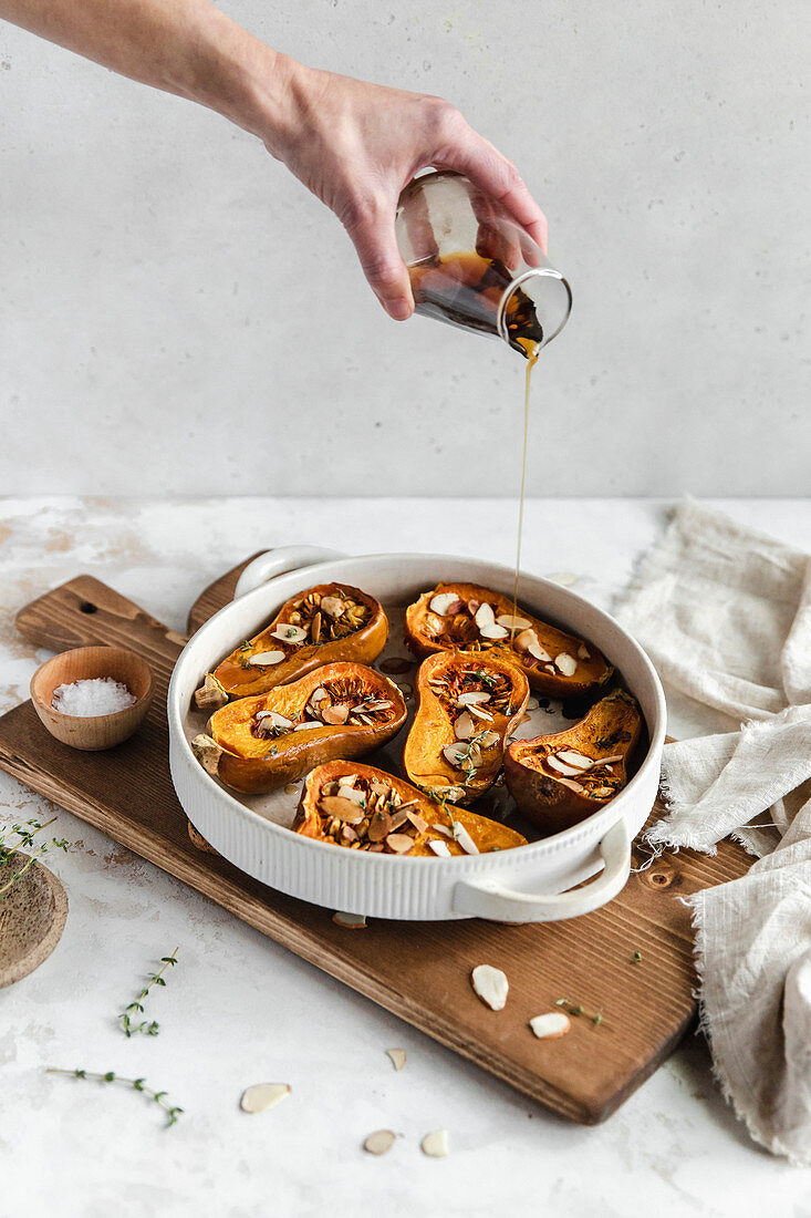 Roasted honeynut squash with maple syrup and sliced almonds