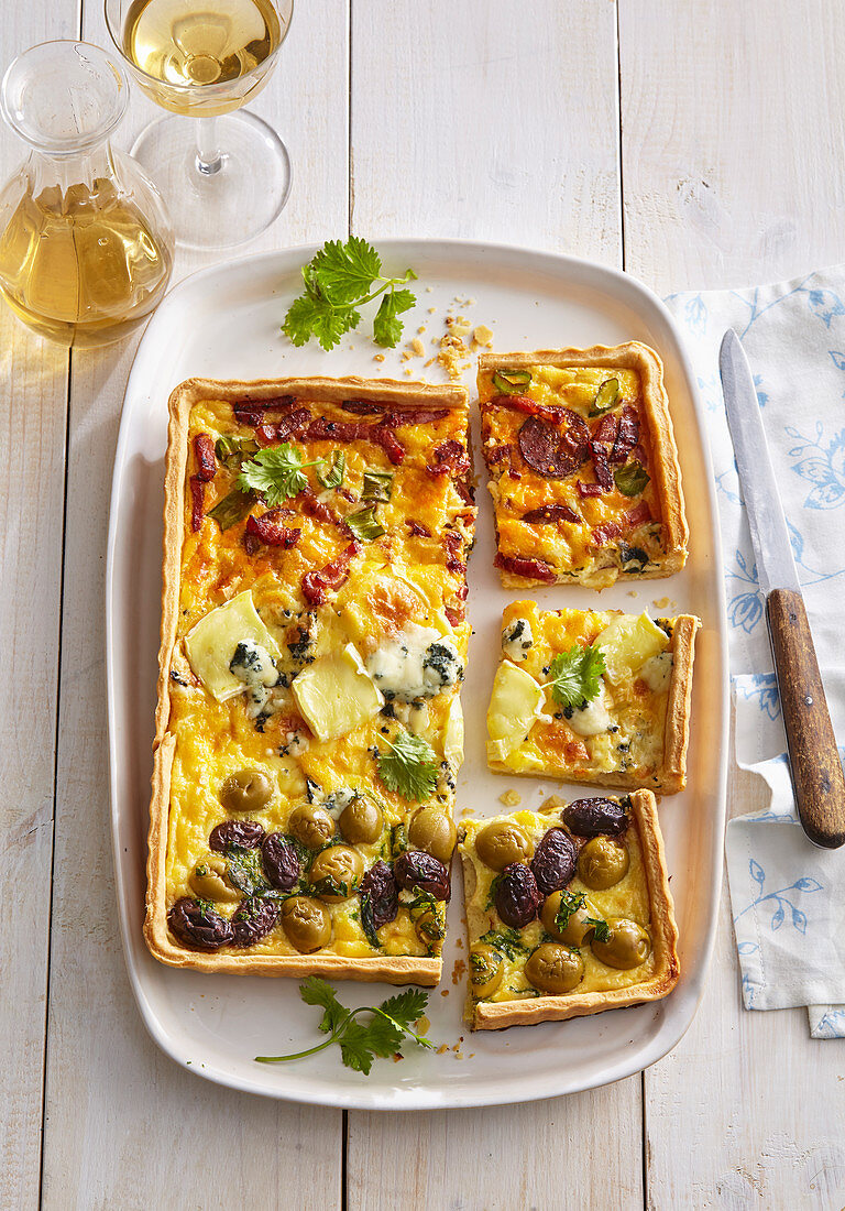 Quiche with sausage, olives and cheese