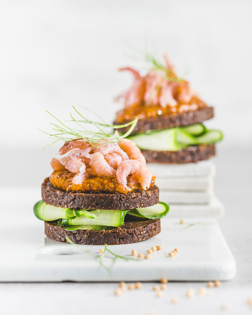 Pumpernickel with cucumber, port mustard (spicy mustard), North Sea shrimp and dill
