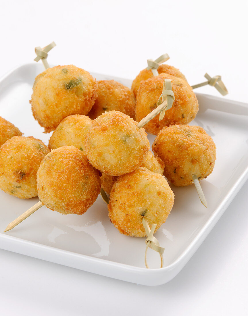 Fried rice balls on skewers