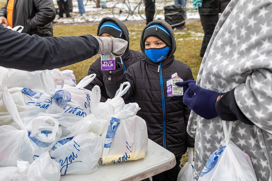 Volunteer distributing meals, Michigan, USA