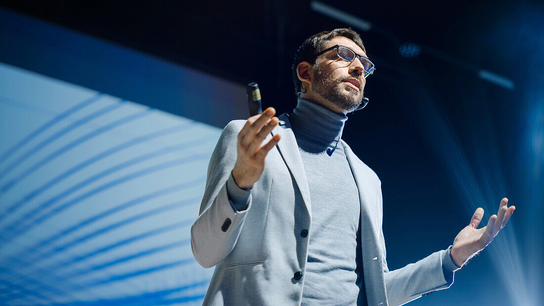 Speaker on stage at conference