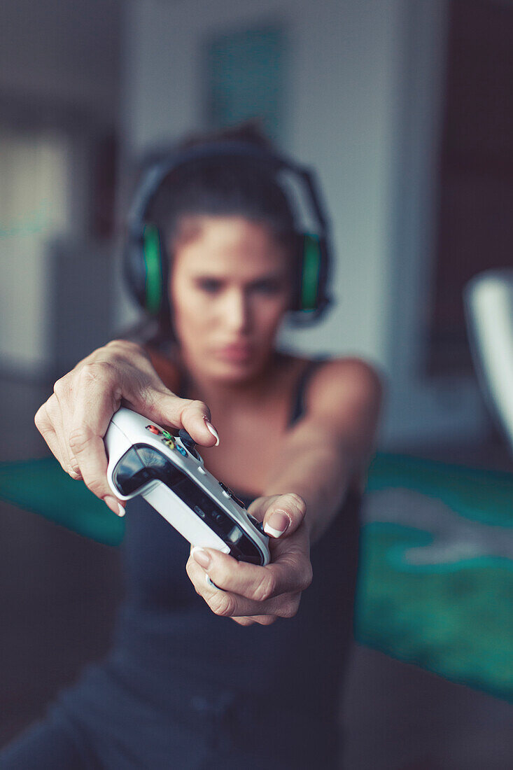 Woman playing on game console