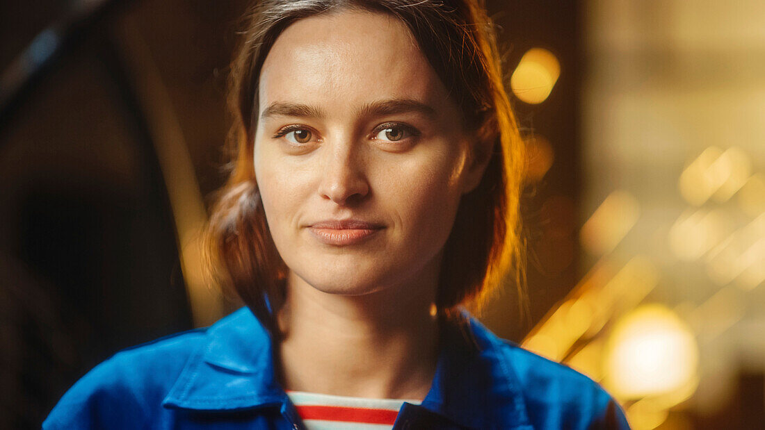 Smiling woman in workshop clothing