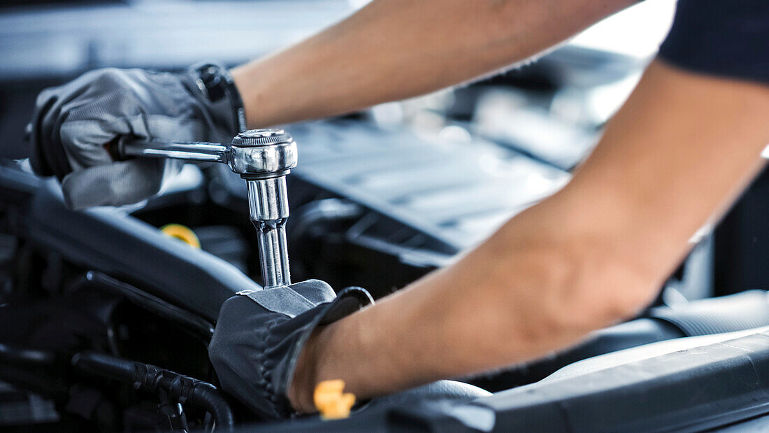 Mechanic working on car