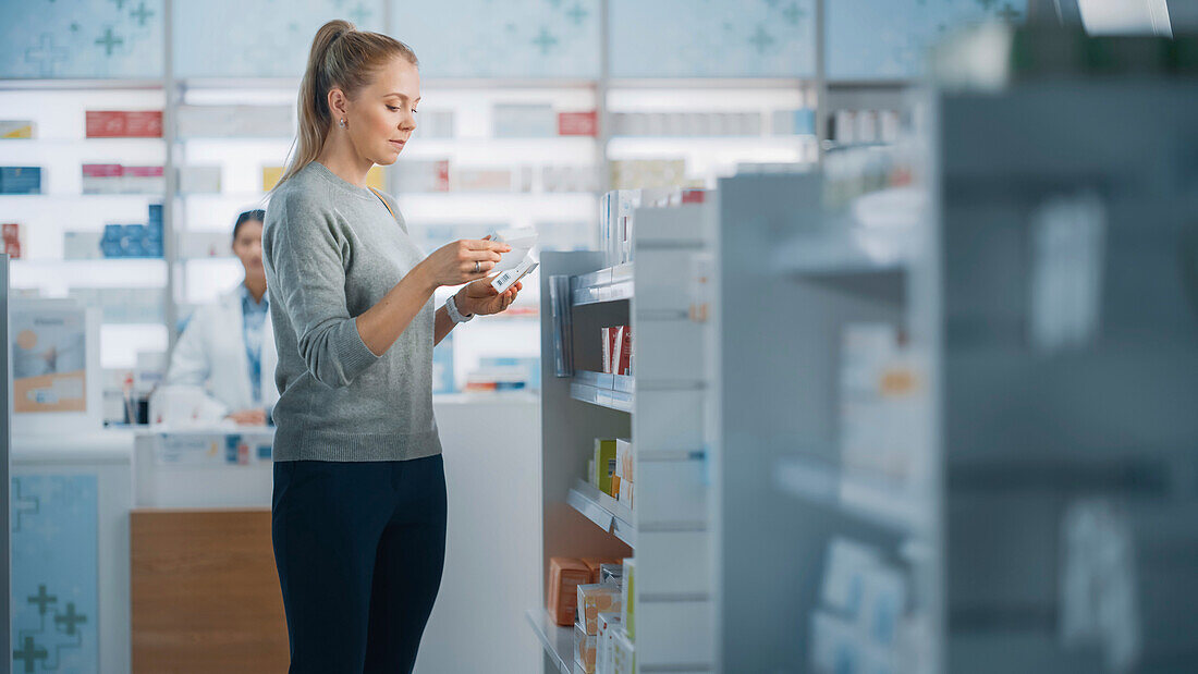 Customer choosing medication in a pharmacy