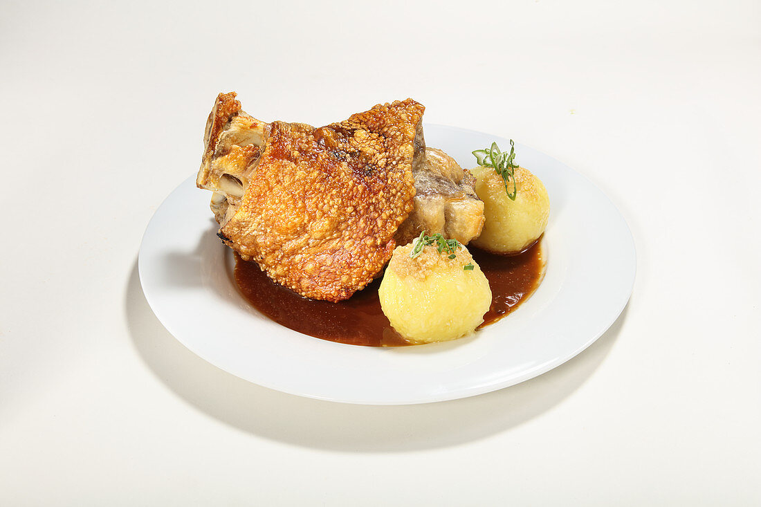 Pork knuckle with potato dumplings