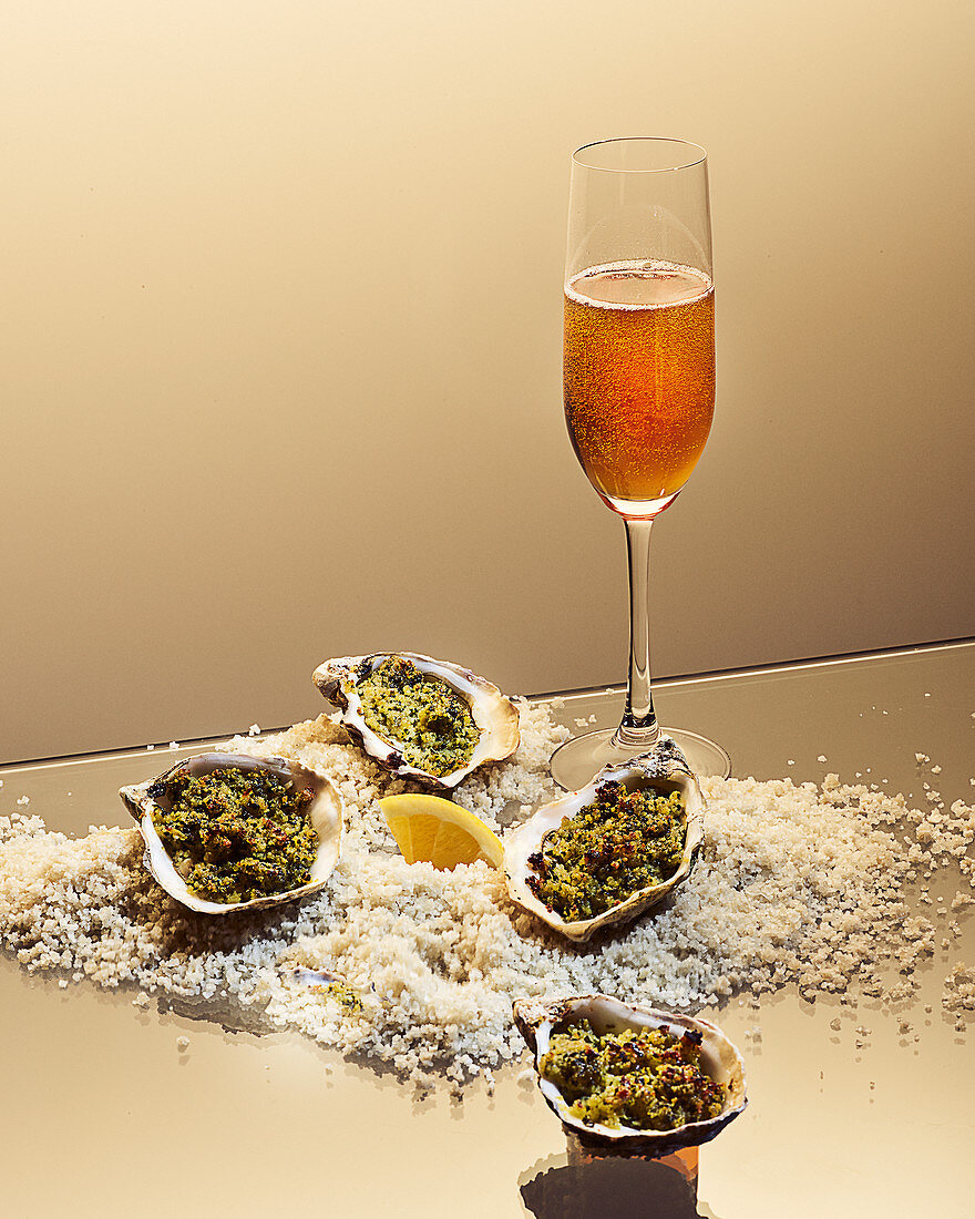 Oysters au gratin with a tea and champagne cocktail