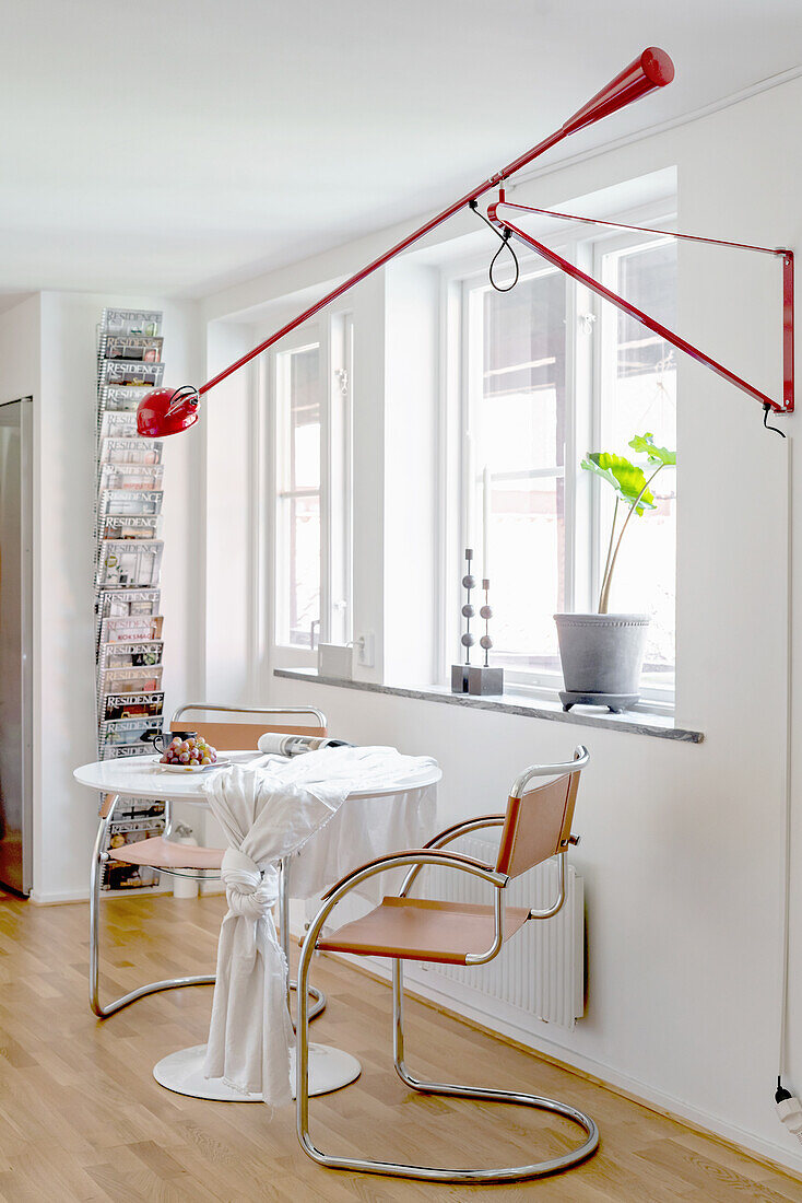 Classic table and cantilever chairs below window