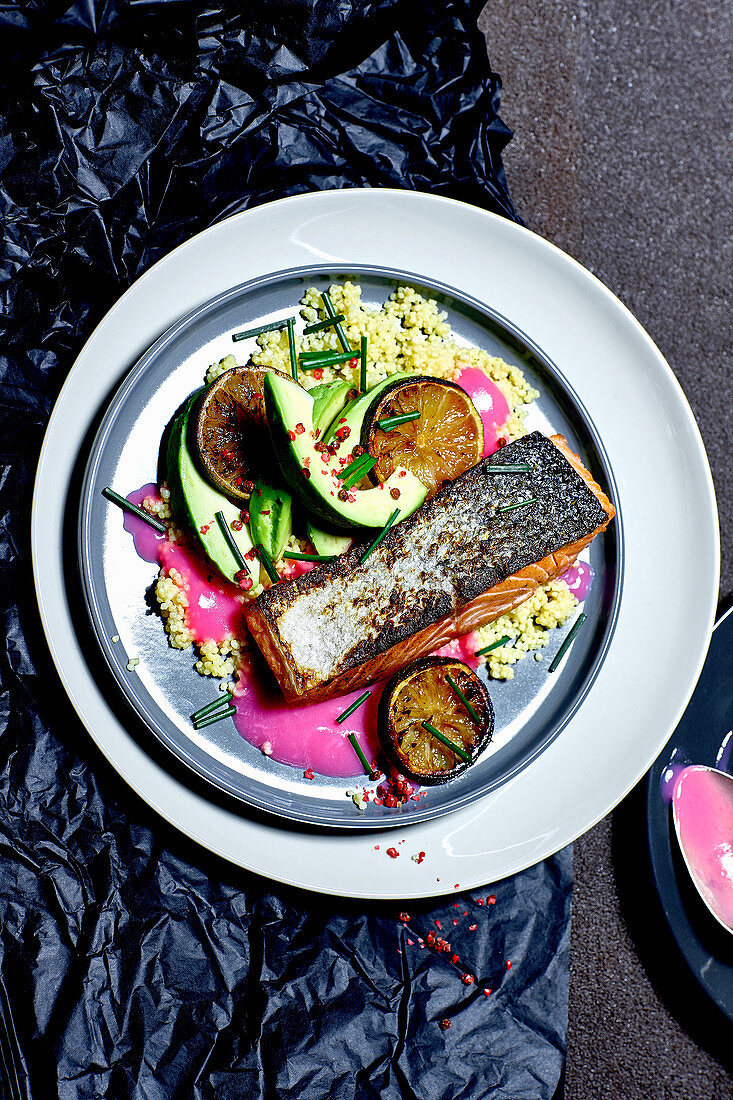 Fried salmon fillet with avocado and lime millet