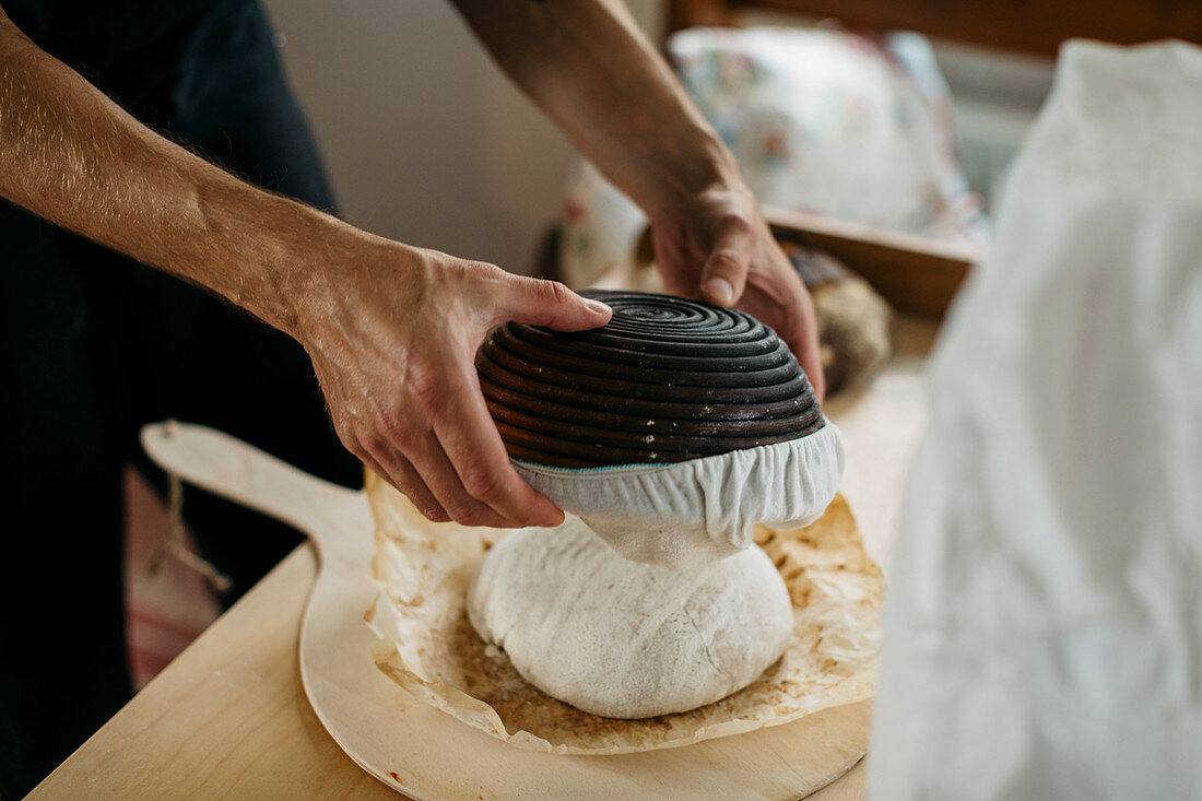Hands making bread