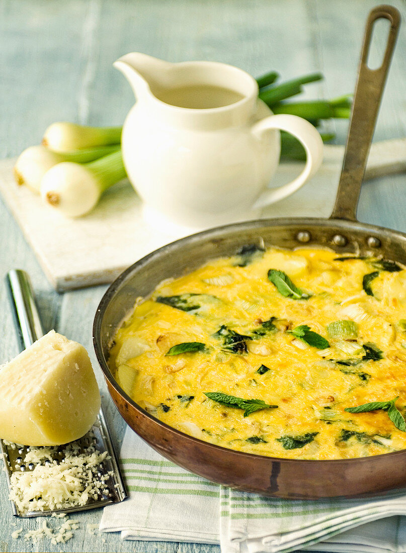 Frittata with spring onions, parmesan cheese and mint