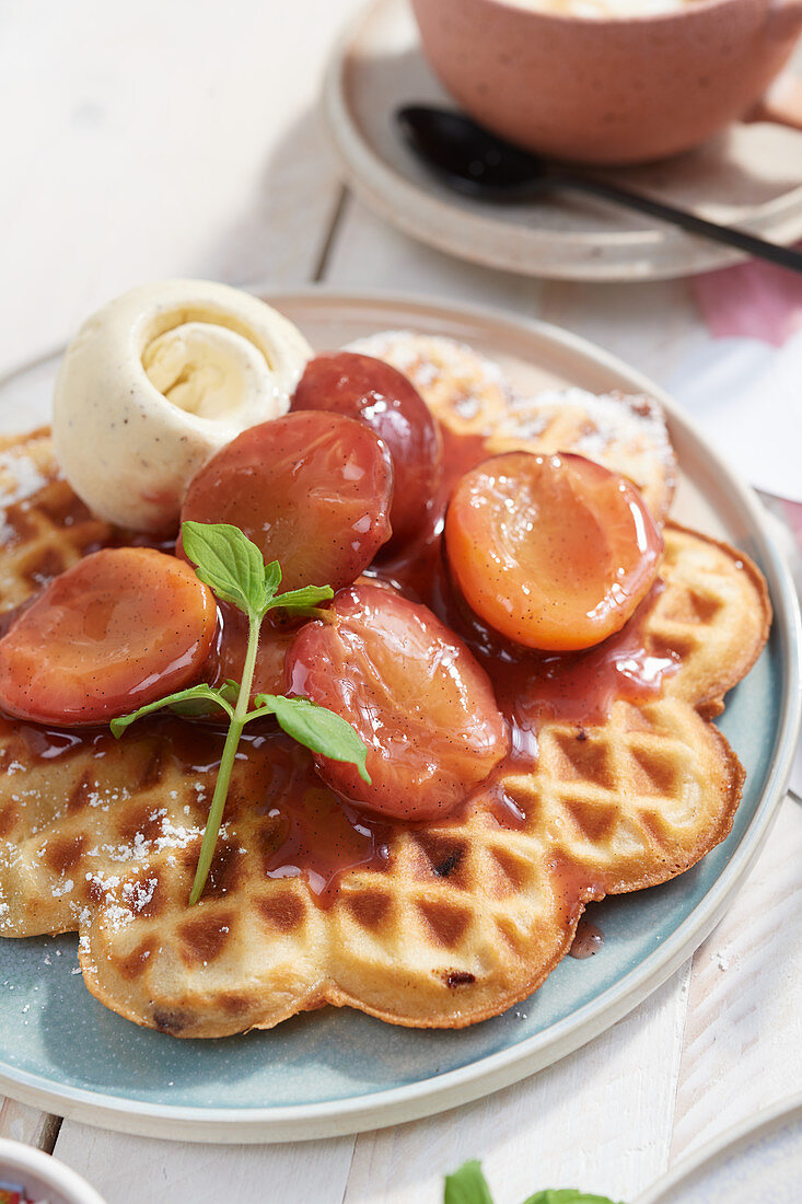 Waffles with roast plums and vanilla ice cream