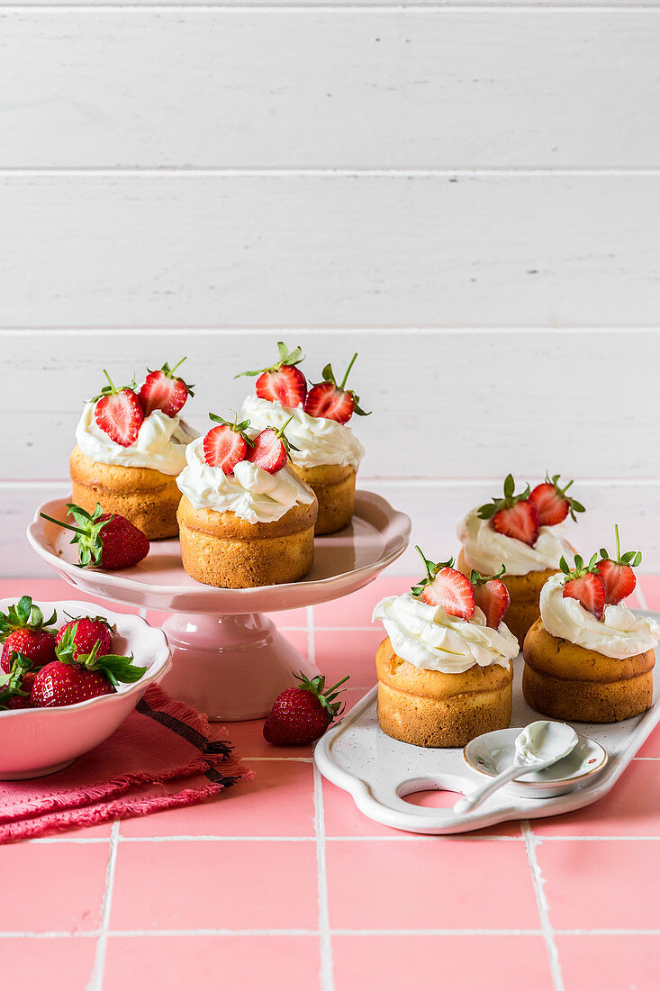 Vanilla Cupcakes with Cream Cheese Topping and Fresh Strawberries