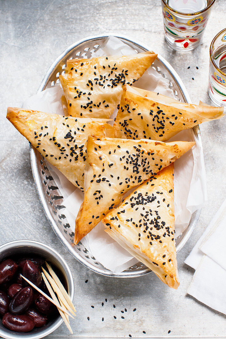 Filo pastry corners with black sesame and olives