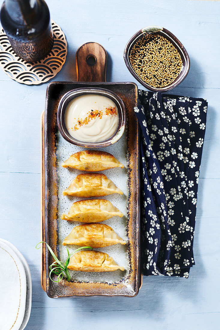 Fried gyoza with soy sauce and mayonnaise