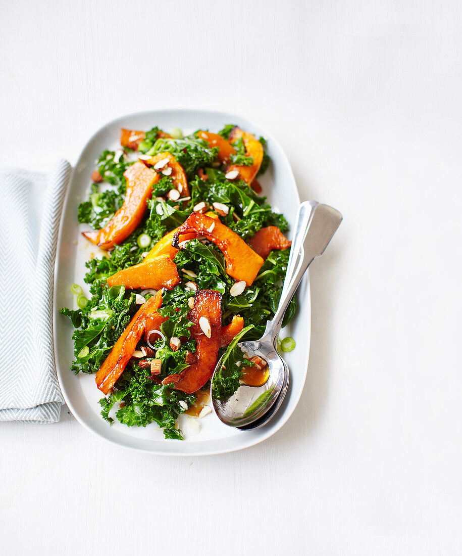 Kale salad with roasted butternut squash, pomegranate molasses and almonds