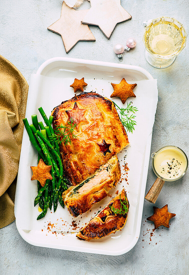 Salmon wrapped in puff pastry with green asparagus