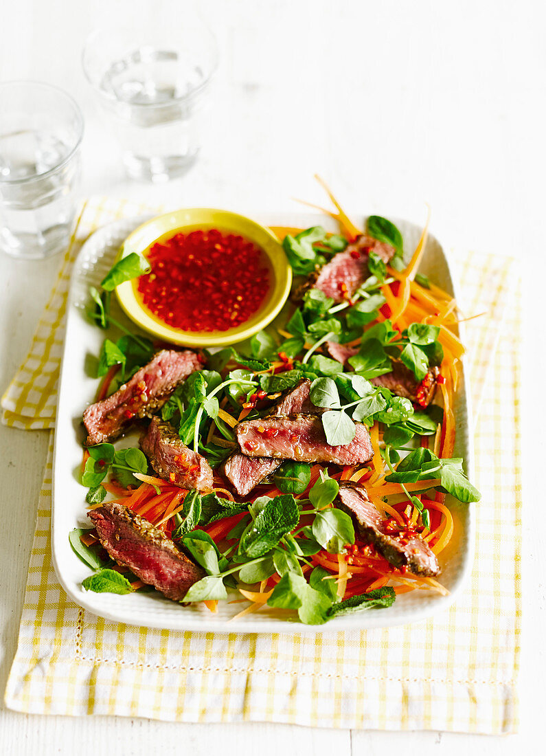 Sesame steak salad with chilli dipping sauce
