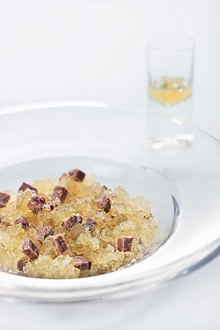 Iced oxtail soup with whiskey drops (molecular cuisine)