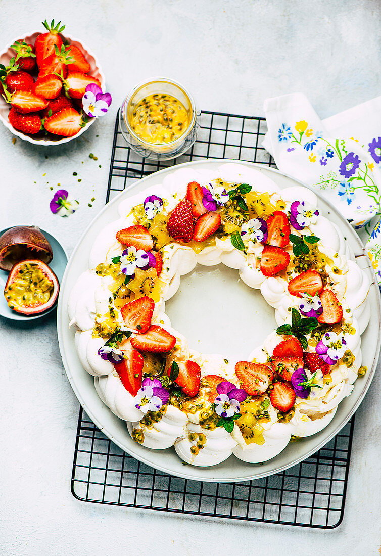 Pavlova with passion fruit and strawberries